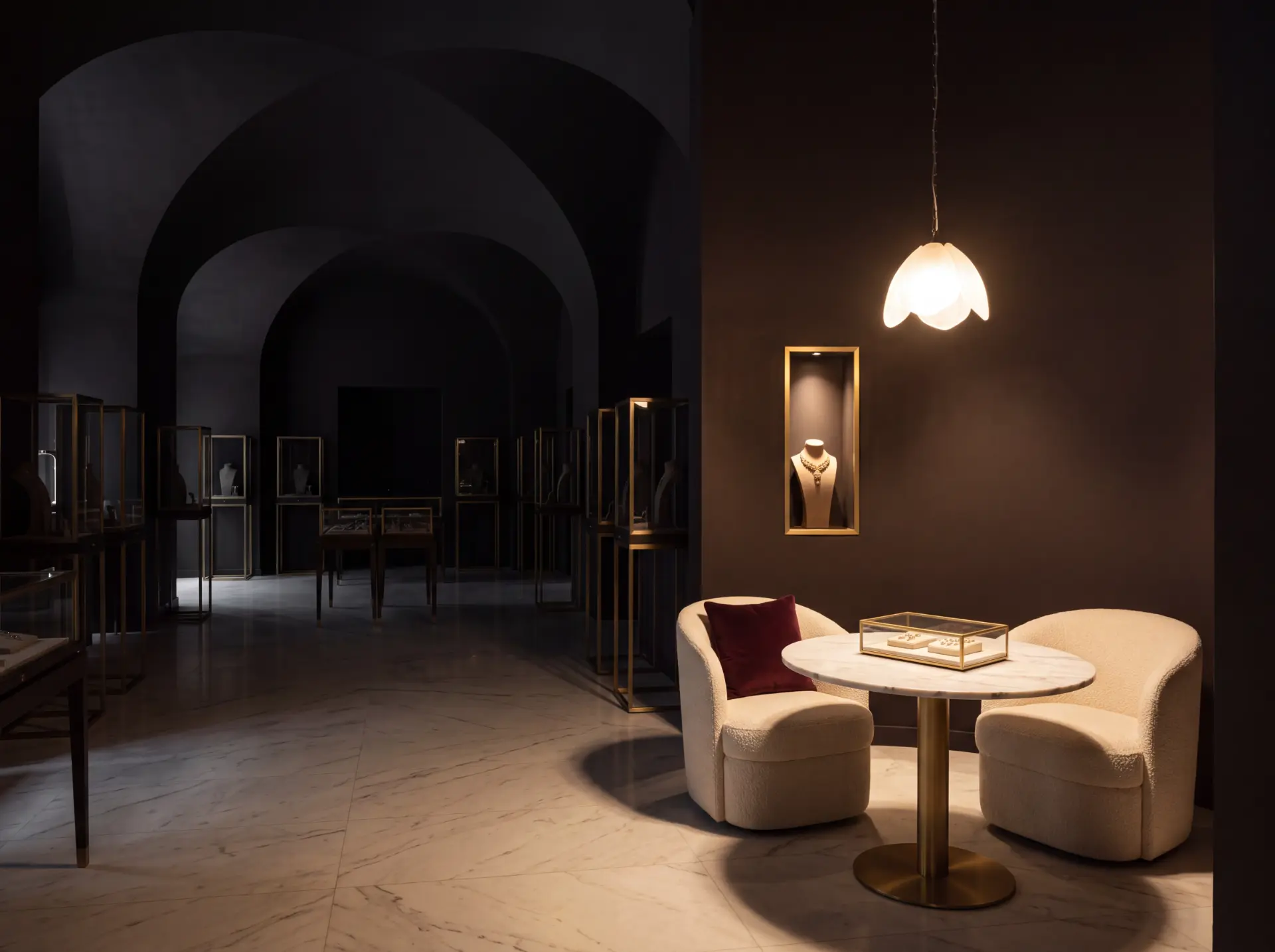 An Evokaa private appointment salon with lit display cases and a seated viewing table