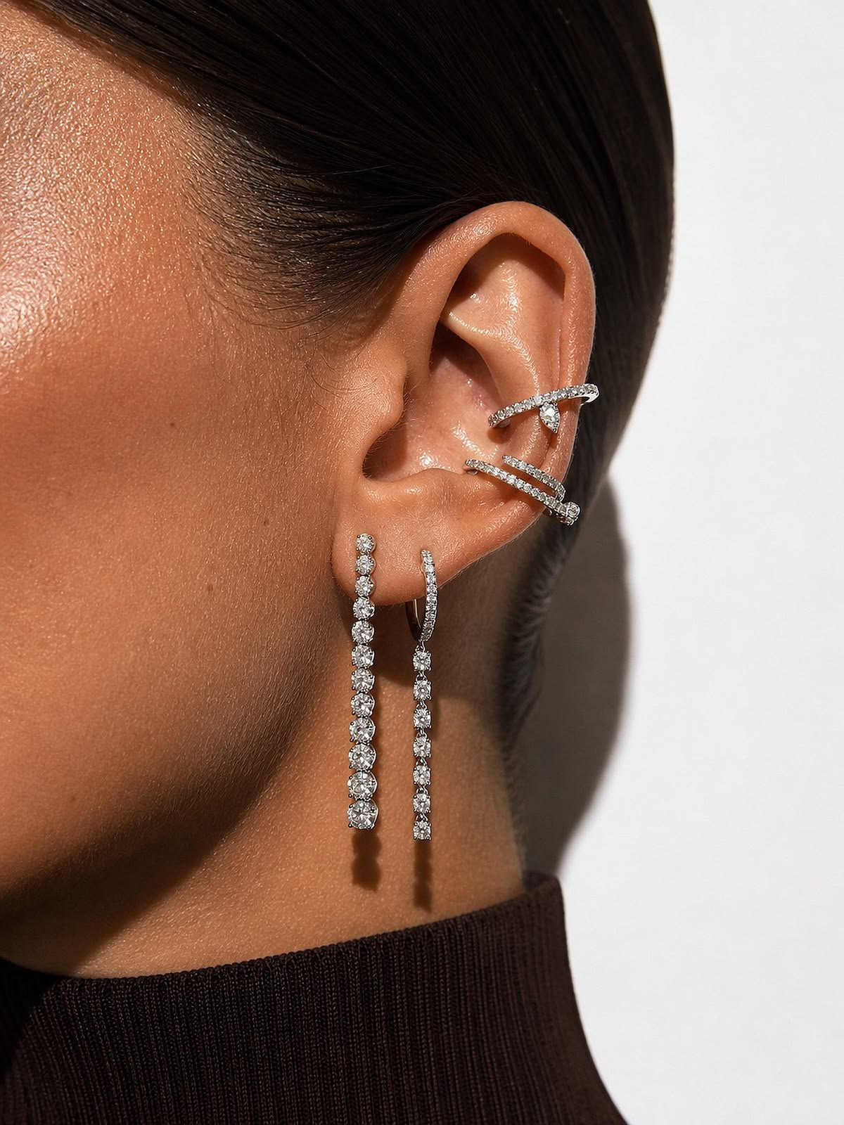 Diamond ear cuffs and line drops worn together