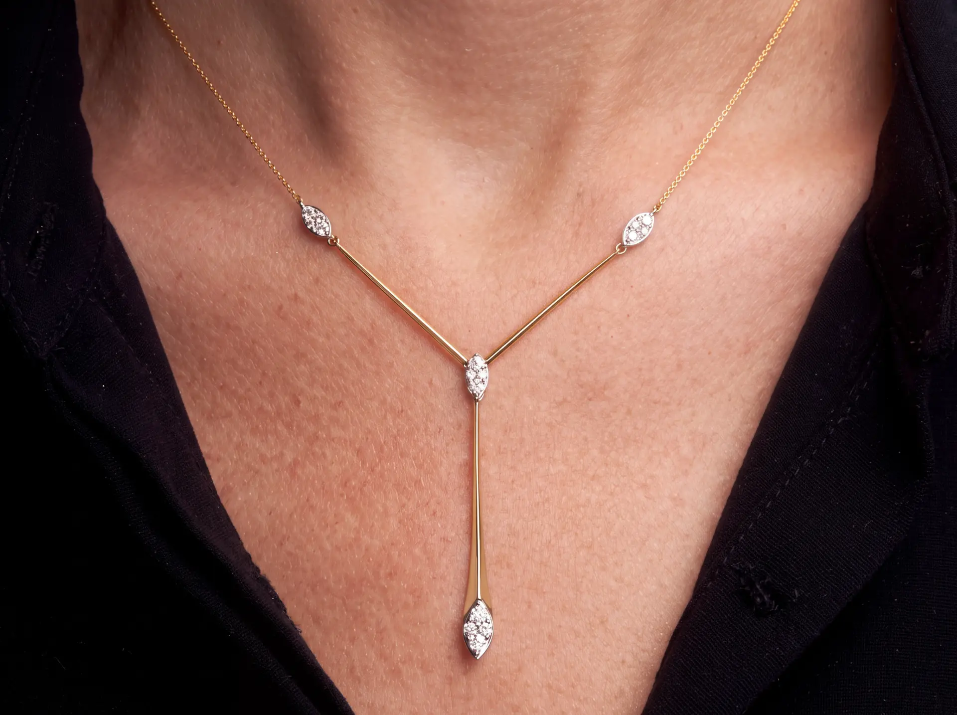 Marquise diamond drop necklace worn at the collarbone