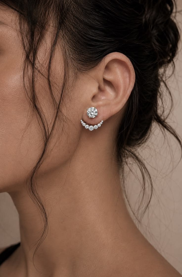 Round crafted diamond stud with a crescent pavé jacket worn at the ear