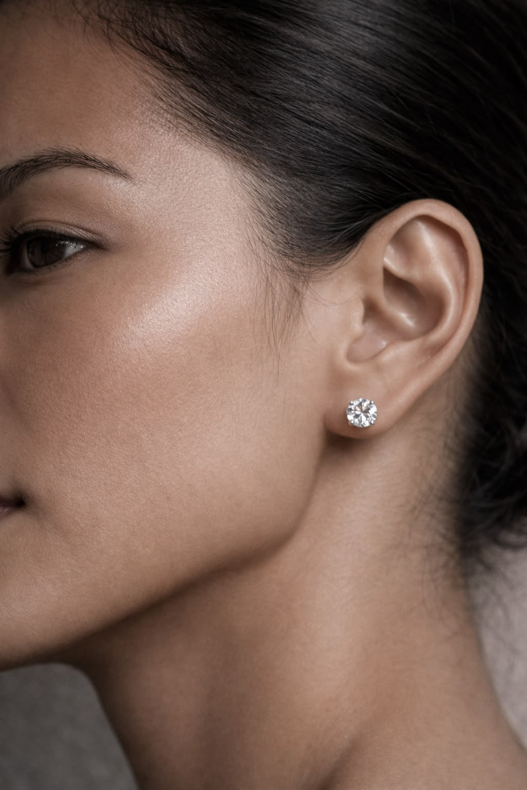 Round brilliant crafted diamond solitaire stud worn at the ear